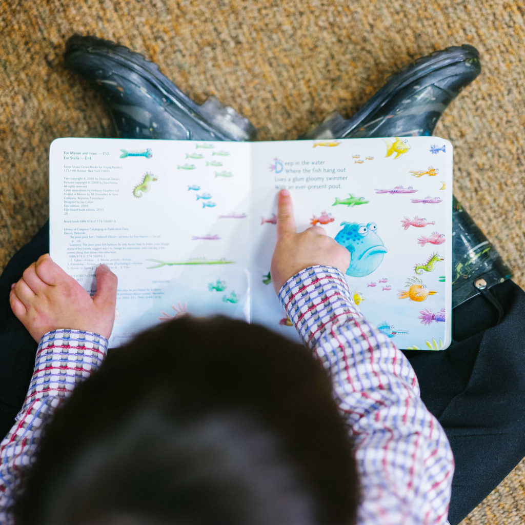 Child Reading Overhead