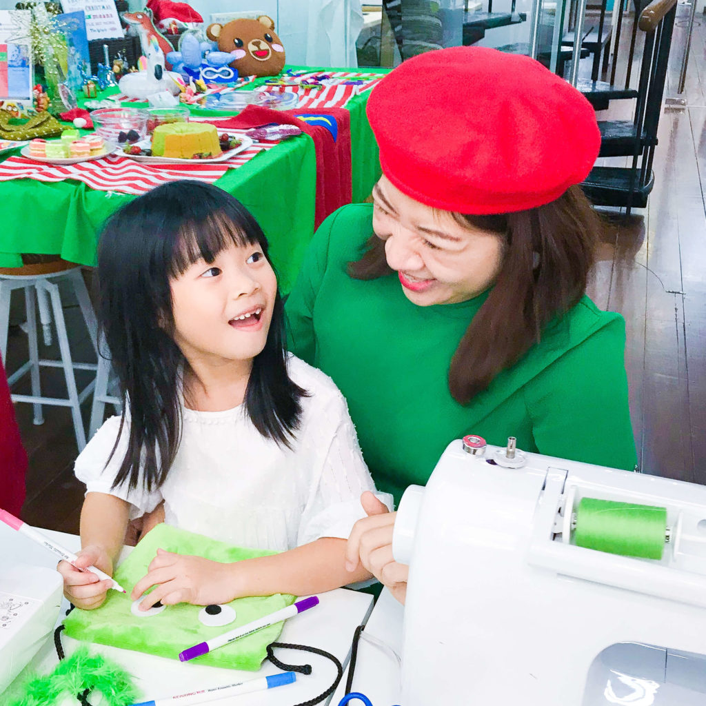 PositiveLeePeilin with Laughing Child at Grinch Workshop