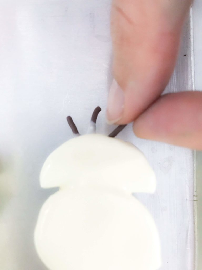DIY Olaf Marshmallow Snowman Putting Chocolate Rice Hair